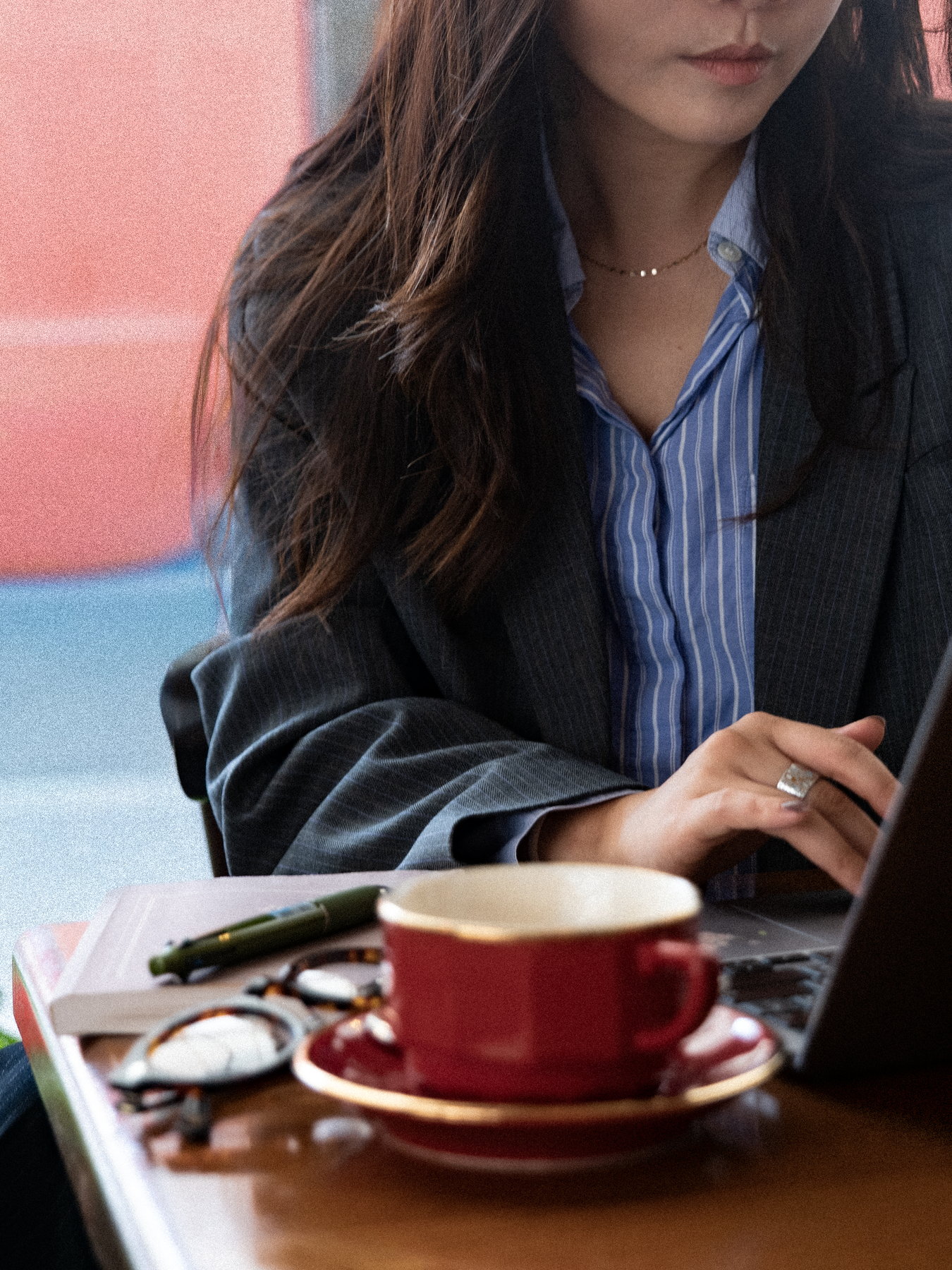 Working at a café table in Paris, laptop and coffee